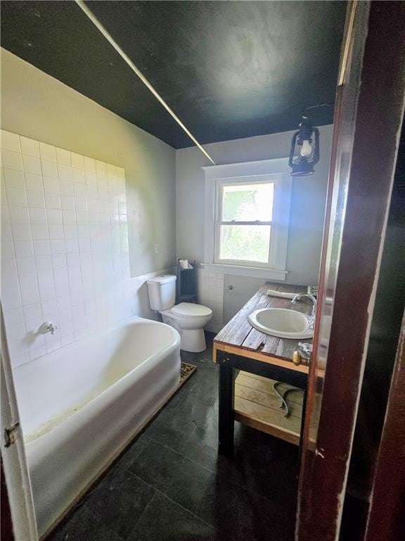 full bathroom with vanity, toilet, tile patterned floors, and washtub / shower combination