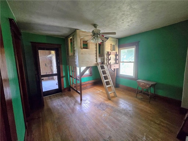 unfurnished bedroom with hardwood / wood-style flooring and ceiling fan