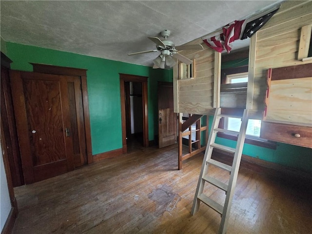 bedroom featuring wood-type flooring and ceiling fan