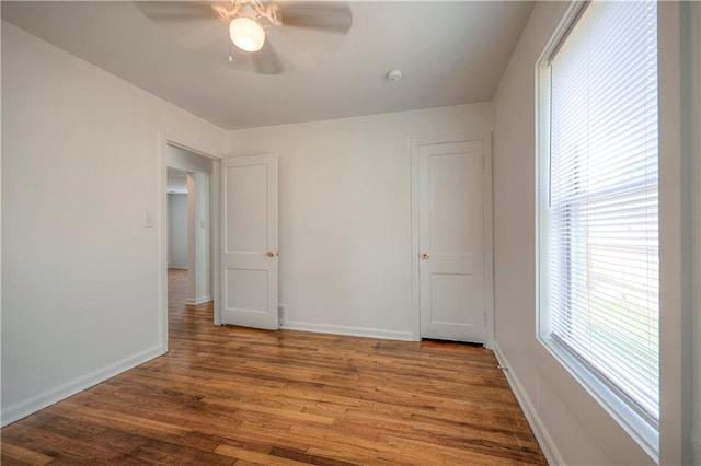 spare room featuring hardwood / wood-style flooring and ceiling fan