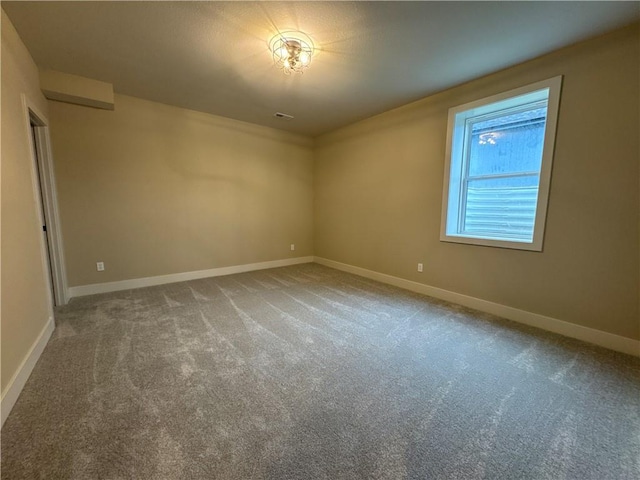 view of carpeted spare room