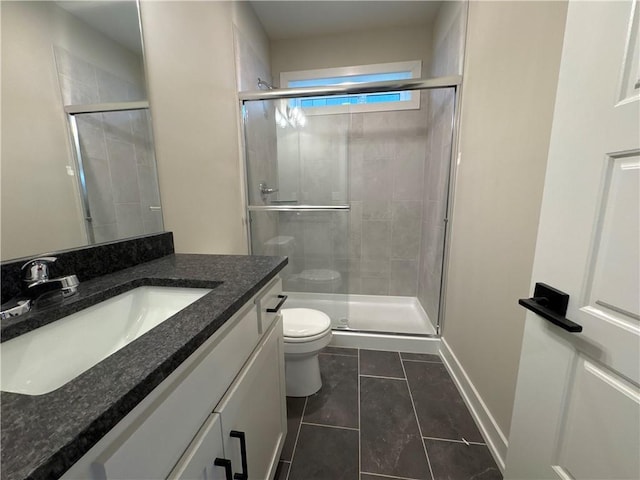 bathroom with vanity, toilet, an enclosed shower, and tile patterned flooring