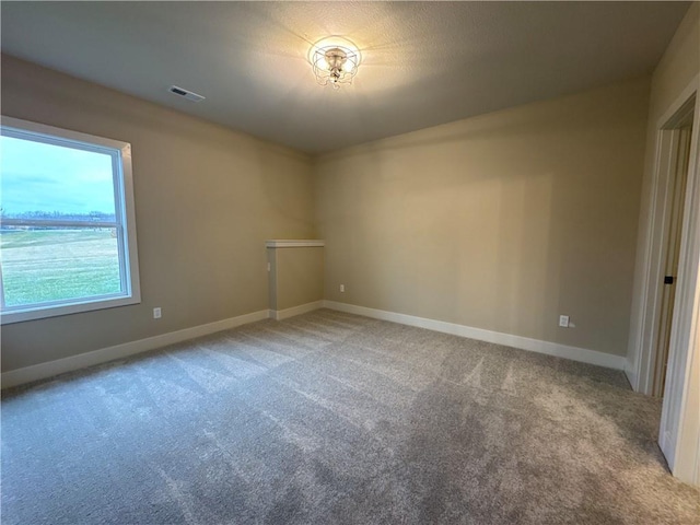 spare room featuring carpet floors