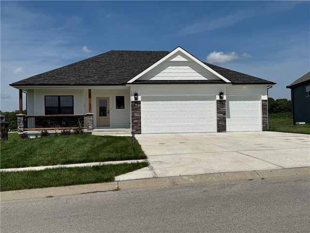 12870 N Champanel Way, Platte City, MO 64079 - view of front facade featuring an attached garage, concrete driveway, a front yard, stone siding, and a porch