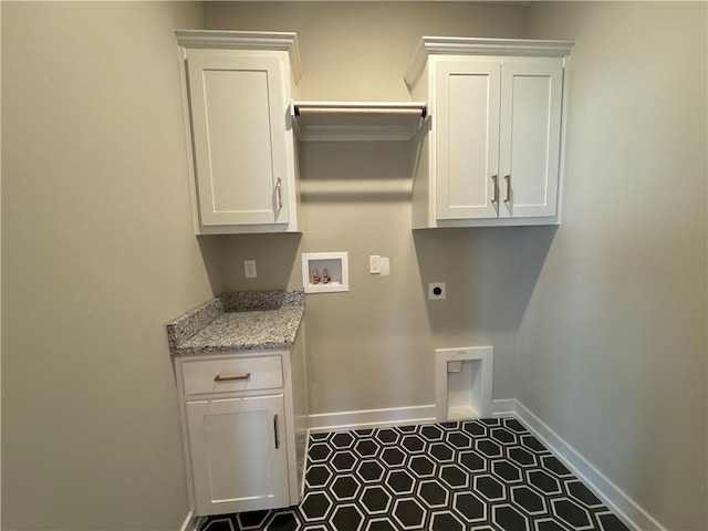 washroom featuring cabinets, washer hookup, and hookup for an electric dryer