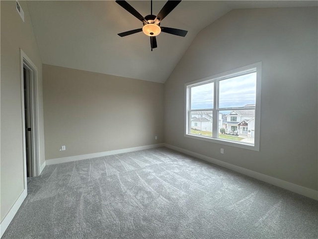 carpeted empty room featuring high vaulted ceiling and ceiling fan