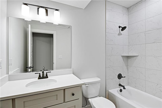 full bathroom featuring tiled shower / bath combo, toilet, and vanity