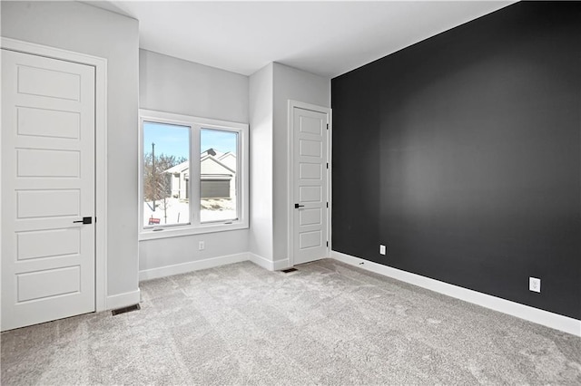 empty room featuring light colored carpet