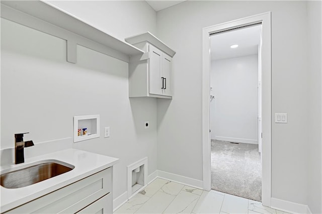 laundry area featuring cabinets, sink, hookup for a washing machine, hookup for an electric dryer, and light colored carpet