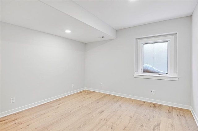 spare room featuring light wood-type flooring