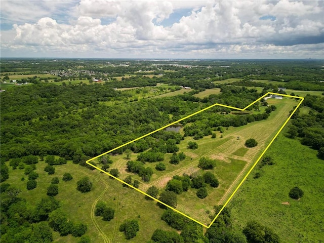 birds eye view of property with a rural view