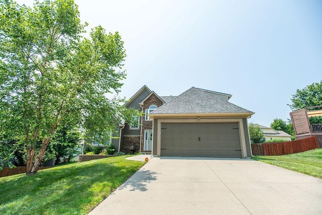 view of front facade featuring a garage and a front lawn