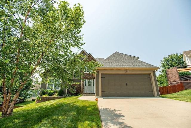 view of front of home featuring a garage and a front yard