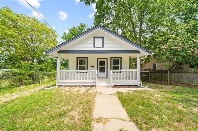 view of front of home featuring a porch and a front lawn