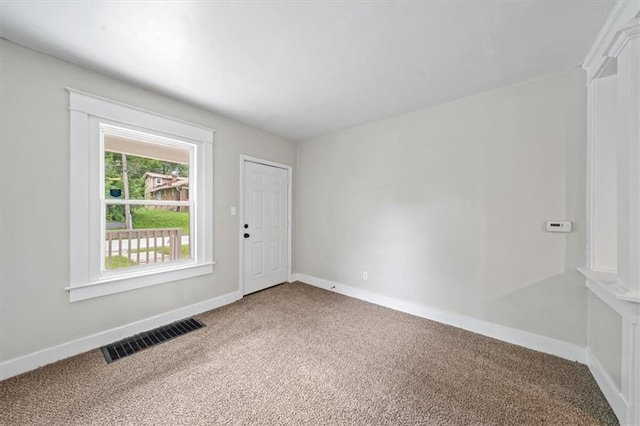 spare room featuring carpet floors