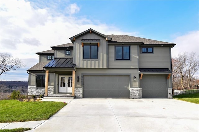 view of front facade with a garage and a front yard