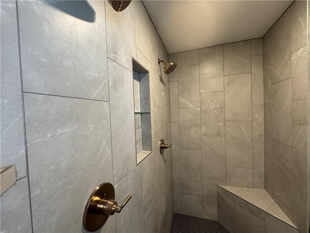 bathroom featuring tiled shower