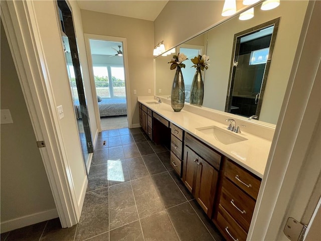 bathroom with vanity, ceiling fan, and a shower with shower door