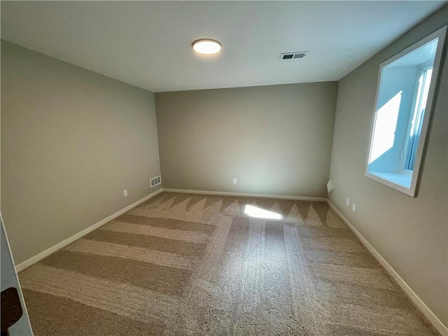 unfurnished room featuring carpet floors