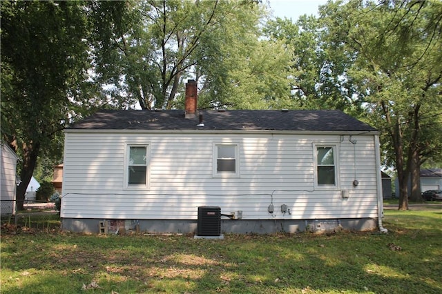 view of property exterior featuring a yard and central air condition unit