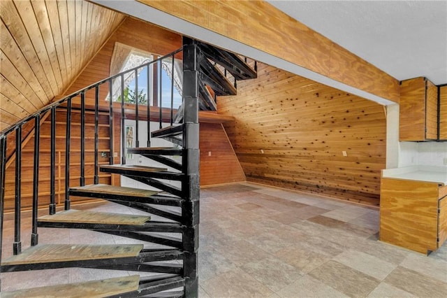 stairs featuring wood walls, light tile patterned floors, and wood ceiling