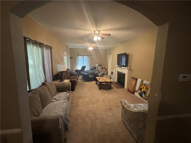 living room featuring ceiling fan and carpet flooring