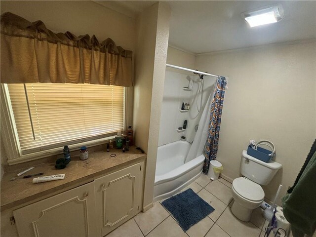 bathroom with tile patterned flooring, toilet, and shower / bath combo