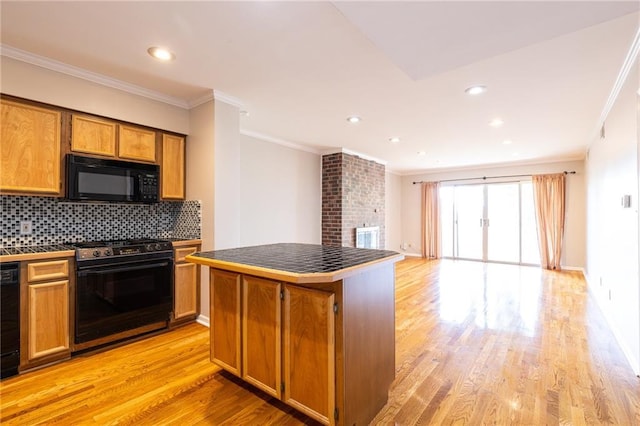 kitchen with light wood-type flooring, brown cabinets, black appliances, tasteful backsplash, and crown molding