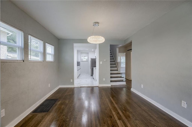 entryway with dark hardwood / wood-style floors