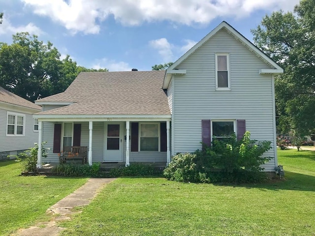 view of front of home with a front yard and a porch