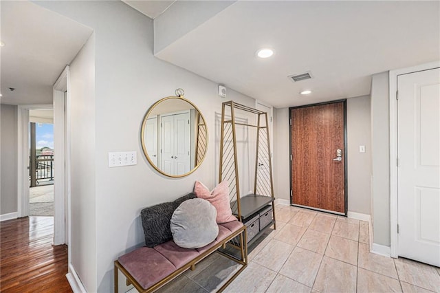 hallway with light tile patterned floors