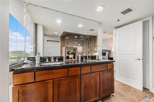 bathroom with vanity, tile patterned floors, and walk in shower