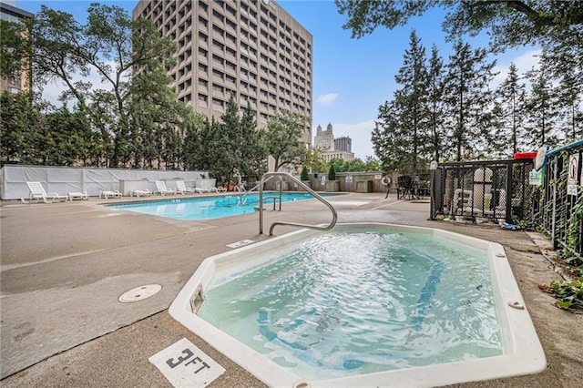 view of swimming pool with a patio