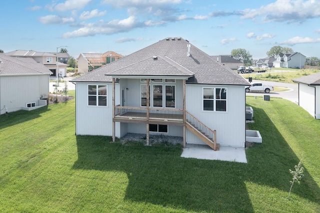 back of property featuring a yard and a patio area