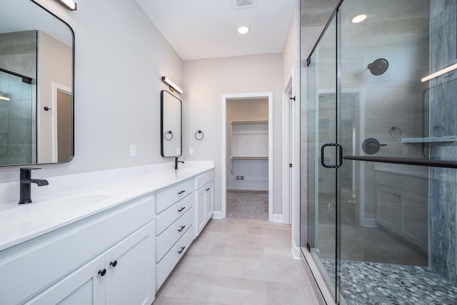 bathroom featuring vanity and walk in shower