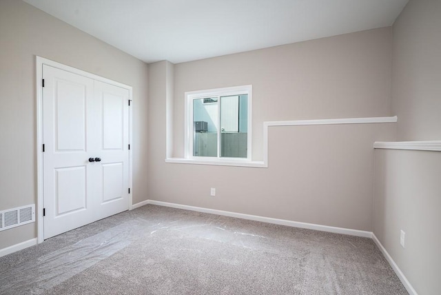 unfurnished bedroom featuring carpet flooring