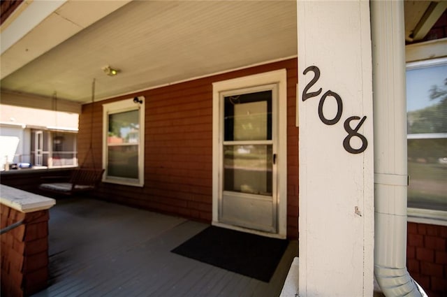 property entrance featuring covered porch