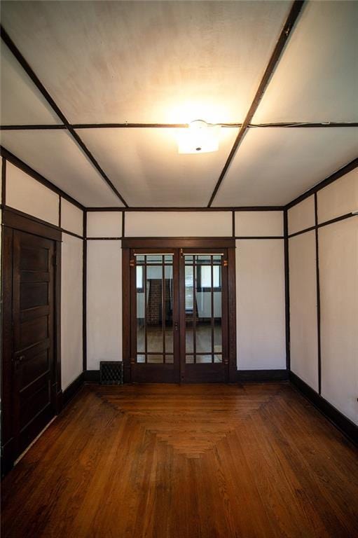 unfurnished bedroom featuring dark hardwood / wood-style floors