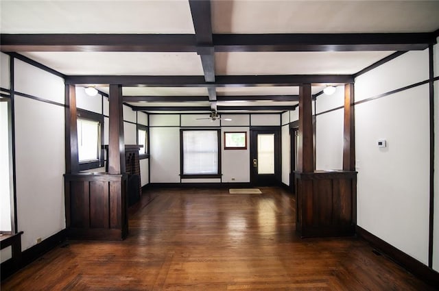 unfurnished room featuring beamed ceiling and dark parquet floors