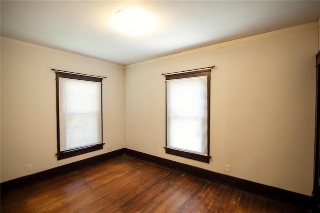 unfurnished room featuring dark hardwood / wood-style floors