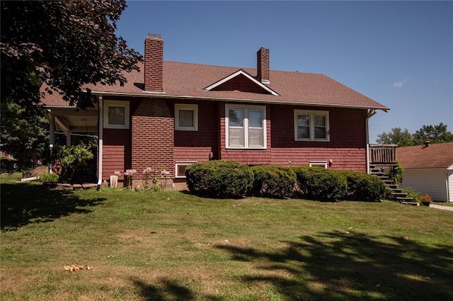 back of house featuring a lawn