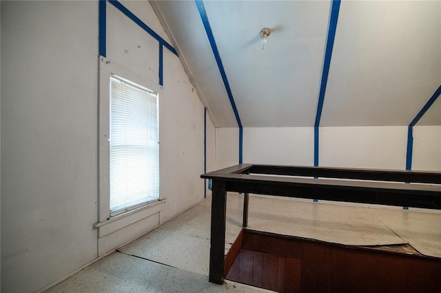 bonus room featuring vaulted ceiling