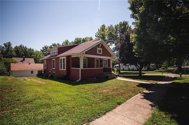 view of home's exterior featuring a yard