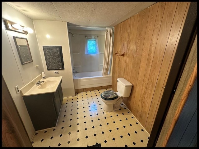 full bathroom with shower / bath combination with curtain, tile patterned floors, toilet, vanity, and wood walls