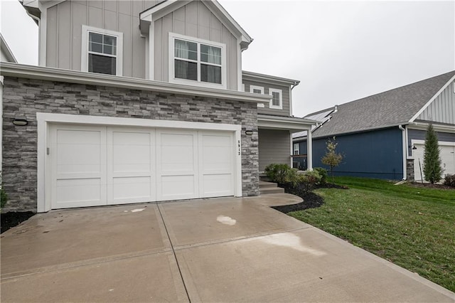 view of front of property with a front yard and a garage