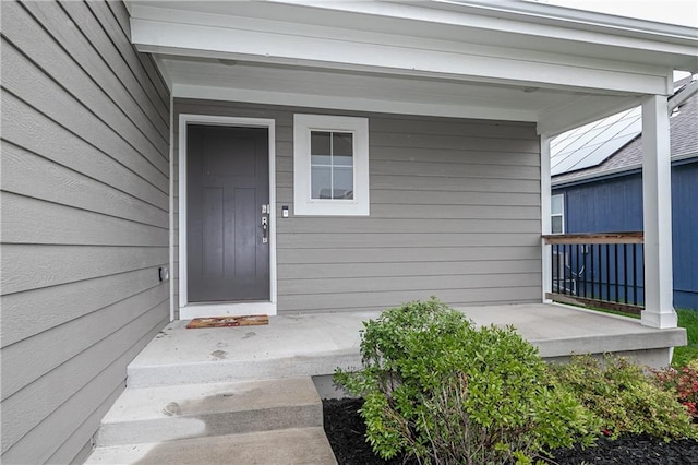 entrance to property with covered porch