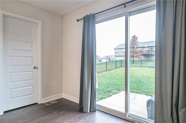 entryway with dark hardwood / wood-style floors