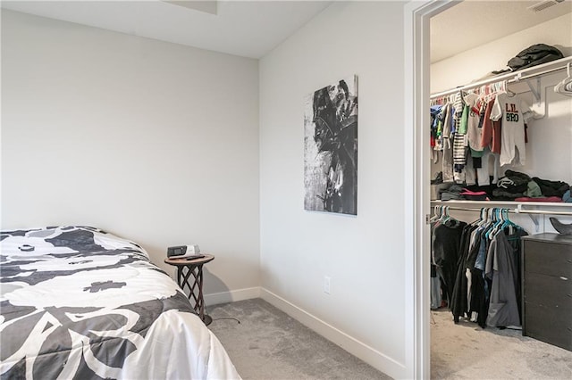 carpeted bedroom featuring a closet