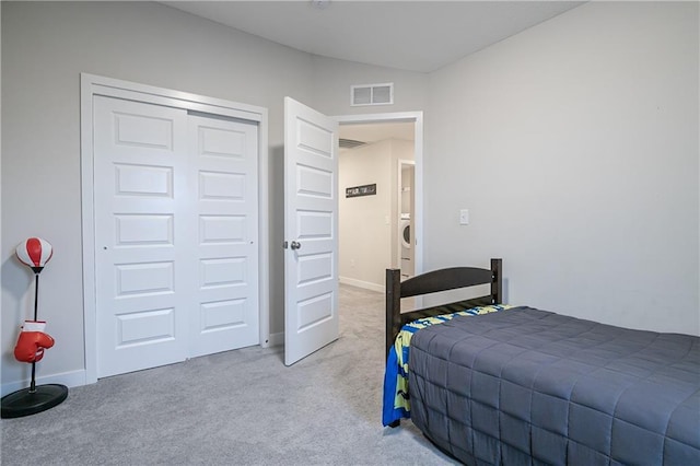 carpeted bedroom featuring a closet