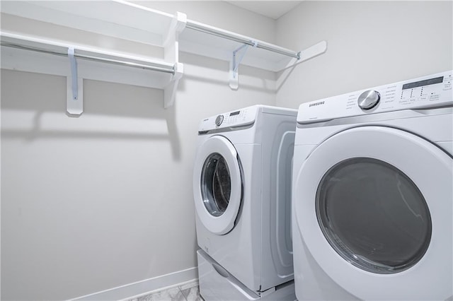 laundry room with washer and clothes dryer